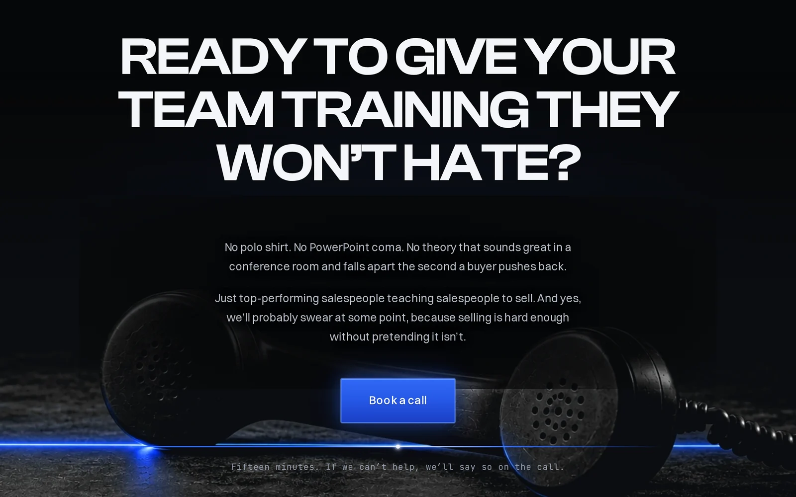 The closing section of the same website: a heavy white question inviting teams to book training, a short paragraph, a blue Book a call button and an old telephone handset lit in blue on a dark ground.